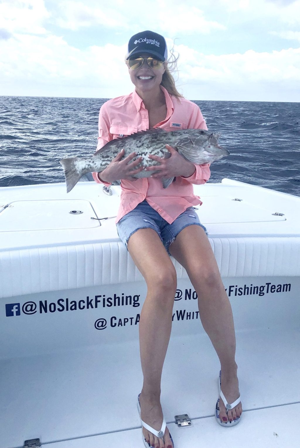 Happy customer on the No Slack Fishing Team catching big grouper and snapper