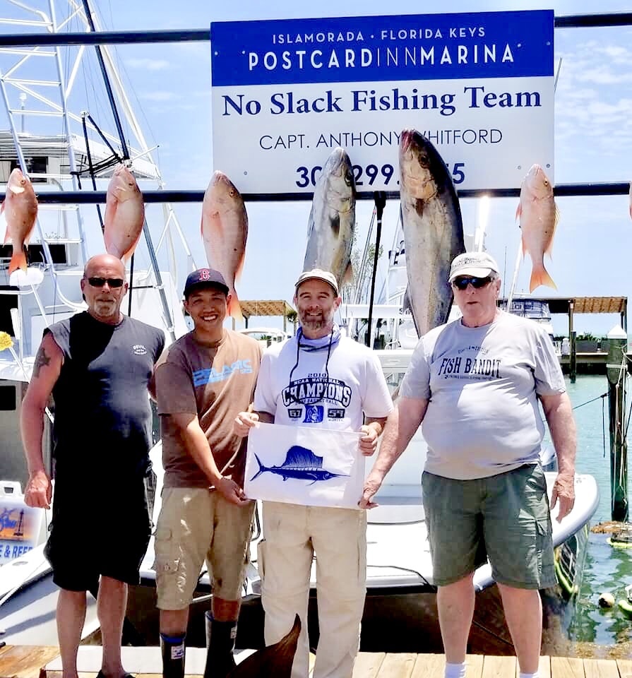 Happy customers fishing on the No Slack Fishing Team out of Post Card Inn in Islamorada Florida